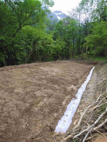 Travaux de terrassement de terrain avec mise en place de drainage à Saint Mury Monteymond 38190